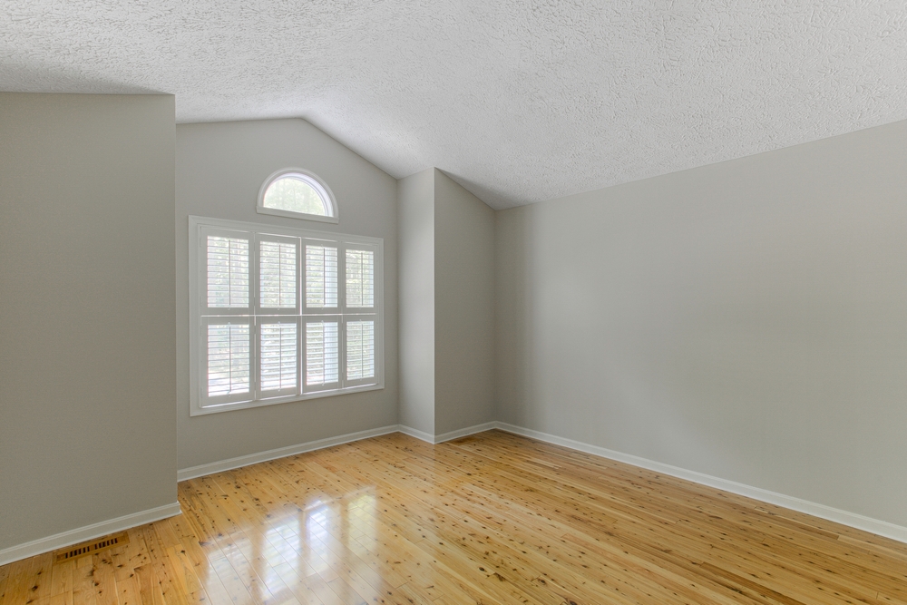 Modern,Bright,Empty,Room,With,Wooden,Flooring,And,A,Window